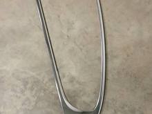 Held on with a few screws and metal clips. He said it was fairly easy to do.