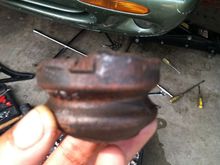 Deteriorated spring assister install atop front shock under gaiter/boot