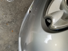 the missing plastic chrome piece fits into a clip where the hole is.