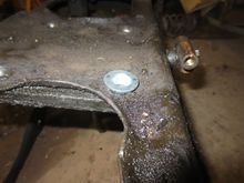 Tapered washer sits in the tapered hole in the cage