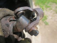 One bearing is out. The other was easily driven out once the pin was oiut of the bracket. I drilled a wide hole in a block of wood to support the bracket and drifted it out downwards.
