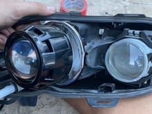 This would be a good time to fit the headlight assembly as is (without the glass lens) and find some place dark to aim the projector and play with its orientation on the reflector. 