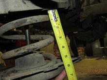 I had to lower mine 5.25" before all weight was off. Stock configuration with 4 of the 1/8" nylon washers.