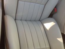 Looking down on the driver seat and the bolster. the heavy wear is gone.