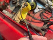 Close up. Green with brown stripe, “L” shap d female spade connection. 