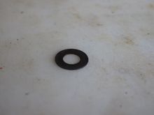 One of the Shims that is needed to fill the Gap between the Caliper and the Steering Arm