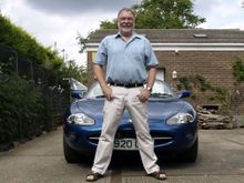 Me Proudly standing in front of my Jaguar XK8