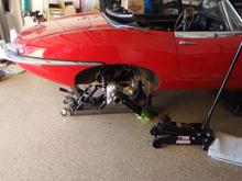 Lifting with ATV jack.  Rags on trailing arms to prevent paint