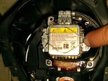 Push down/in on wire clip and remove from latch