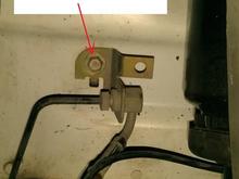 Disconnect brake line bracket and move away from suspension. May need to unclip speed sensor cable from brake line.