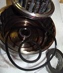 disassemble clutch drums clean and replace seals, soak new disc in Mercon V and lube seals and touching surfaces with trans assembly lube
