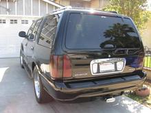 Monochrome front and rear bumpers.  Tinted tail lights, rear view camera.