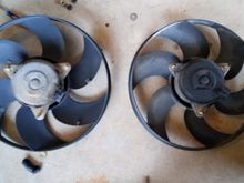 Three 10mm bolts hold the fan to the shroud.  The new one was dirty but was quiet.