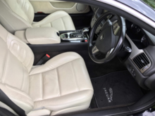 XKR with standard interior.  R Sport leather seating surfaces, all other leather-like surfaces are synthetic.  