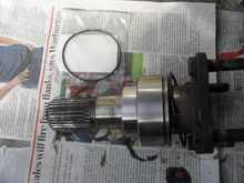 The output shaft then pulls straight out.  There's only friction holding it in once the circlip is off.  The new o-ring seal is in the packet - stupidly expensive for a bog standard o-ring.  The o-ring fits in the empty groove shown in the photo.