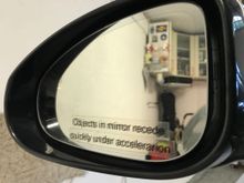 Objects in mirror recede quickly under acceleration
