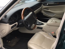Interior is not too bad...like that wood tiller and the seats are a bit sportier than my XJ8