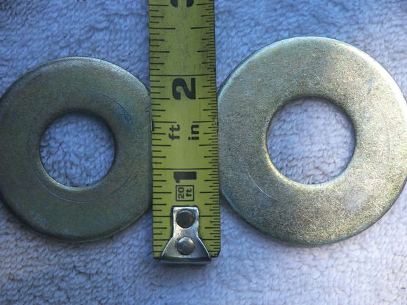 2 different size washers used, big ones go against spring seat in car
