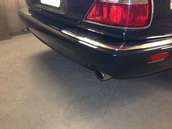 Rear bumper...front is just as nice.  Can't really see it, but, this was brush painted in flat black in places, couple cracks and dings.  The white dust is from the buffing compound.