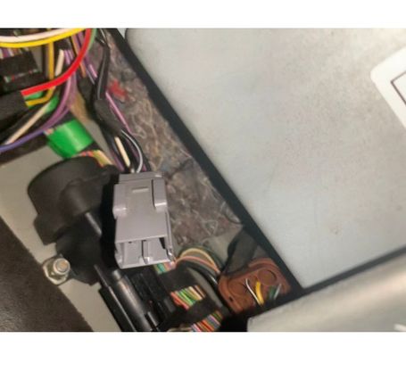 This plug near inertia switch, unplugged, can’t see any place to plug it in, may be spare one