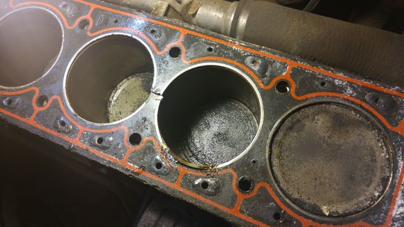 The great divide between Cyl 2 &3...it's painful to admit how much like a vacuum leak this initial failure felt like.  A compression test should be on the list right after the usual vacuum line tests. Lots of deformation around the coolant passages, note how much smaller the holes in the gasket are compared to the block and head (next pic)