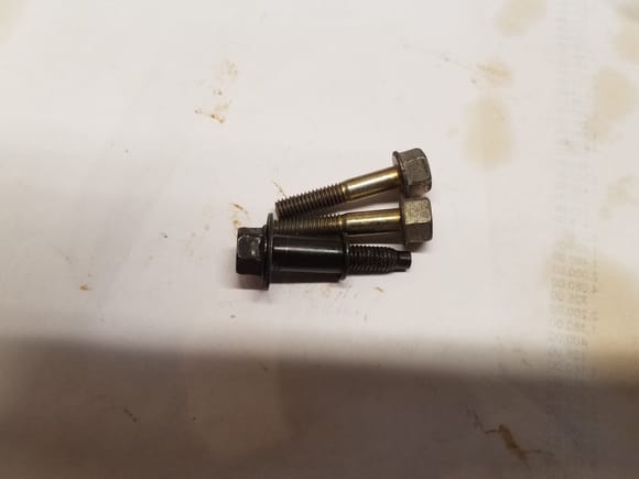 The gold color bolts are what you are looking for. I measure the bolts and the standard cam bolt is 1.35". The gold color are 1.25". I put the standard bolt in the position nearest the cam sensor on a spare head I have. The standard bolt will go all the way through and hit the cam sensor.