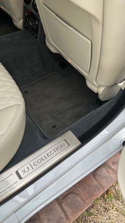 OEM mat in the rear passenger - notice how the OEM mat doesn't match the carpet any better than the Llyod's