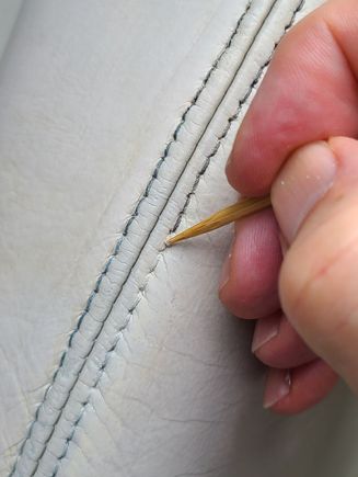 Using the kebab skewer and alcohol to uncover my stitching the day after the dye job.