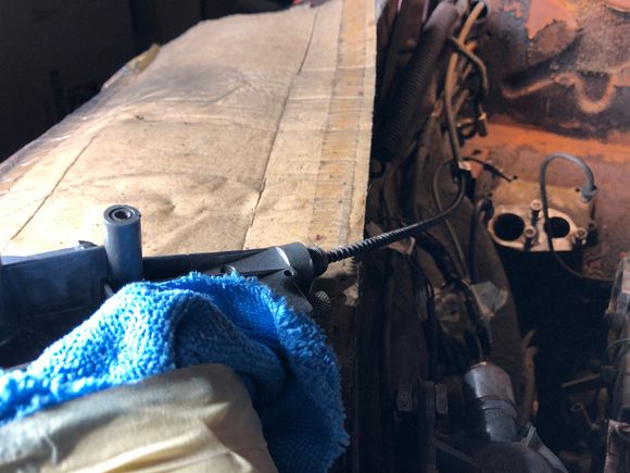 The picture shows that it is the cable running through the guide tube.  In feeding it back in it only goes enough to engage the first wiper spindle. 

Ray