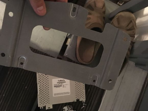 24. Put the mounting plate on your new tuner and reverse the process to install it!