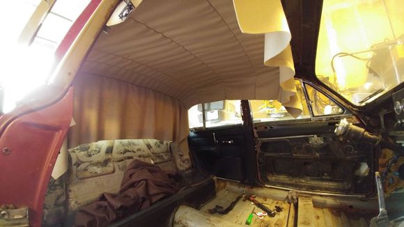 This is the headliner hanging from the bows. Remember that the bows install in a particular place  front to back, they wont work if you get them out of order, so label prior to removal.