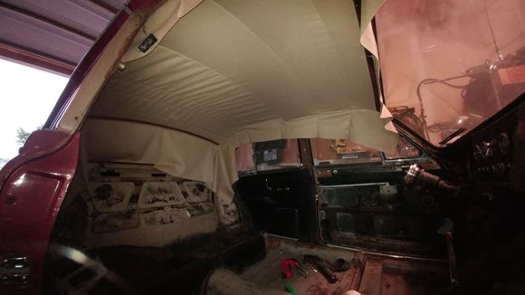 There's some debate on where to start, But I start in the middle, stretching ans smoothing both sides, working my way forward, then back. I probably removed most of the staples in place here for later adjustments - so expect to staple, adjust, stretch, staple-again.