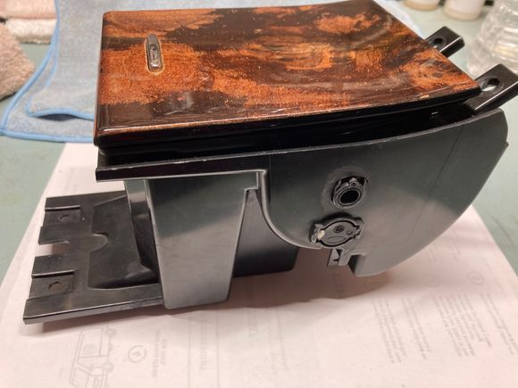 Side view of replacement ashtray unit. Note two from brackets that attach under bridge trim and flat tray that attaches under cupholder bay.