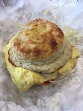 A massive and incredibly delicious Bacon, Egg, and Cheese on a house made Biscuit Breakfast Sandwich from St. Joe’s Cafe. 