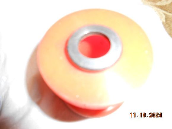 special donut washer #28 sits on the top of the new poly bushing