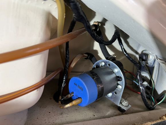 Aftermarket modern pump to be replaced with leaking SU pump once repaired. 