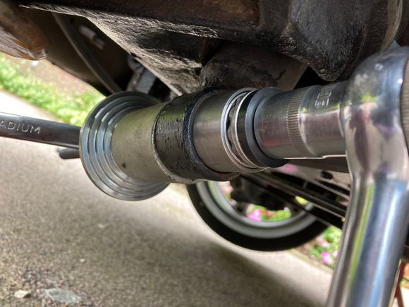 A pal with a lathe skimmed an old 40mm bush outer and skimmed the inside so it fitted over the rubber dust cover which made the job very easy. I changed both rear bushes in 2 and a half hours. 