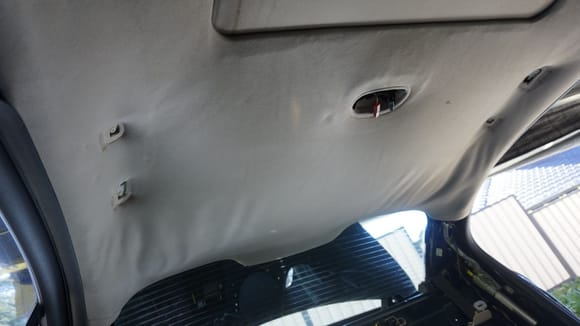 Old dirty and sagging headliner. Understand the following: If a headliner is sagging, it is not the thin fabric, which is visible, which detached itself, but that fabric was attached to a layer of foam, which disintegrated into foam-dust over time.