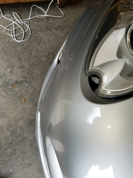 the missing plastic chrome piece fits into a clip where the hole is.