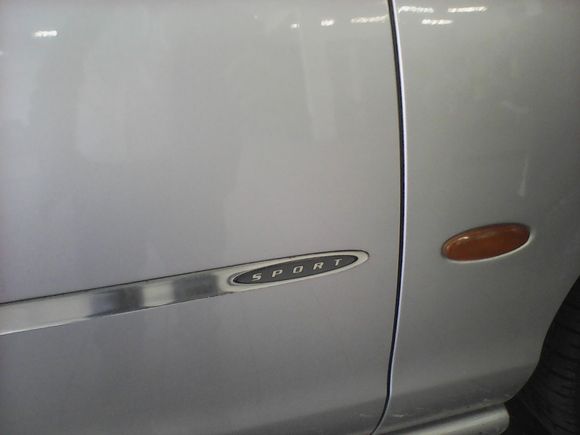 It has manual gearbox, perforated leader sport seats and the sign SPORT on the side of the front doors.