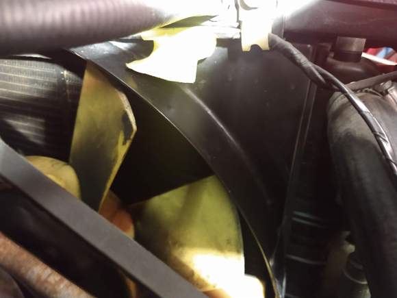 
If you have a yellow fan like this, most recommend replacing.  Also take care as this is attached to the engine and if you're lifting the engine, don't lift too much as you'll jam the fan into the shroud.