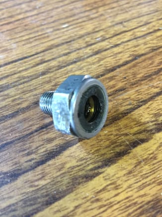 Oil pressure sensor with plastic electrical connector removed, drilled and tapped for ⅛" NPT