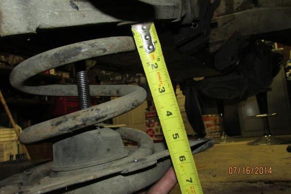 I had to lower mine 5.25" before all weight was off. Stock configuration with 4 of the 1/8" nylon washers.