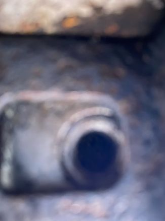 This is a bad photo of the area the bolt couldn't fit back in to - due to the mount slightly obstructing it. This is the outermost right-hand / offside bolt. Oddly, the offside bumper and rubber fit better than the nearside despite not being able to fit the bolt in properly?