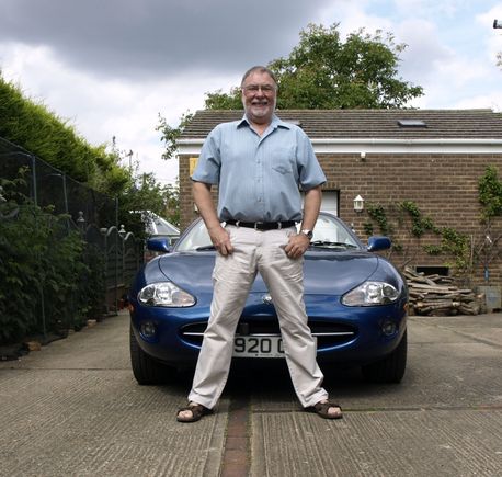 Me Proudly standing in front of my Jaguar XK8