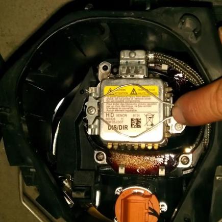 Push down/in on wire clip and remove from latch