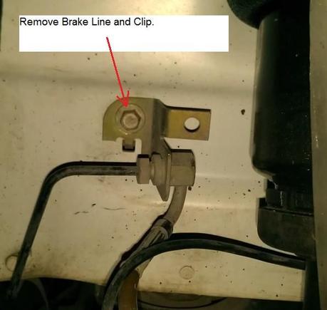 Disconnect brake line bracket and move away from suspension. May need to unclip speed sensor cable from brake line.
