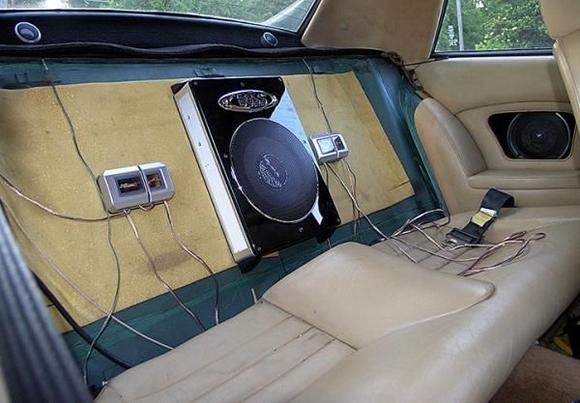 5 1/4 inch JVC component speakers installed in stock location, w/ separate tweeters installed on package shelf. Crossovers, and Boss 8" powered subwoofer installed behind rear seatback. Shot during installation