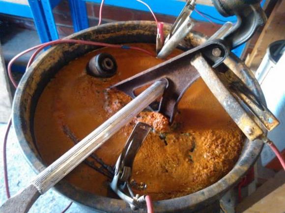 brown stuff = rust being removed
