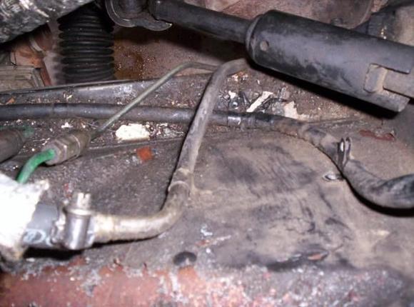 Peeling paint from leaking brake fluid on inner fender